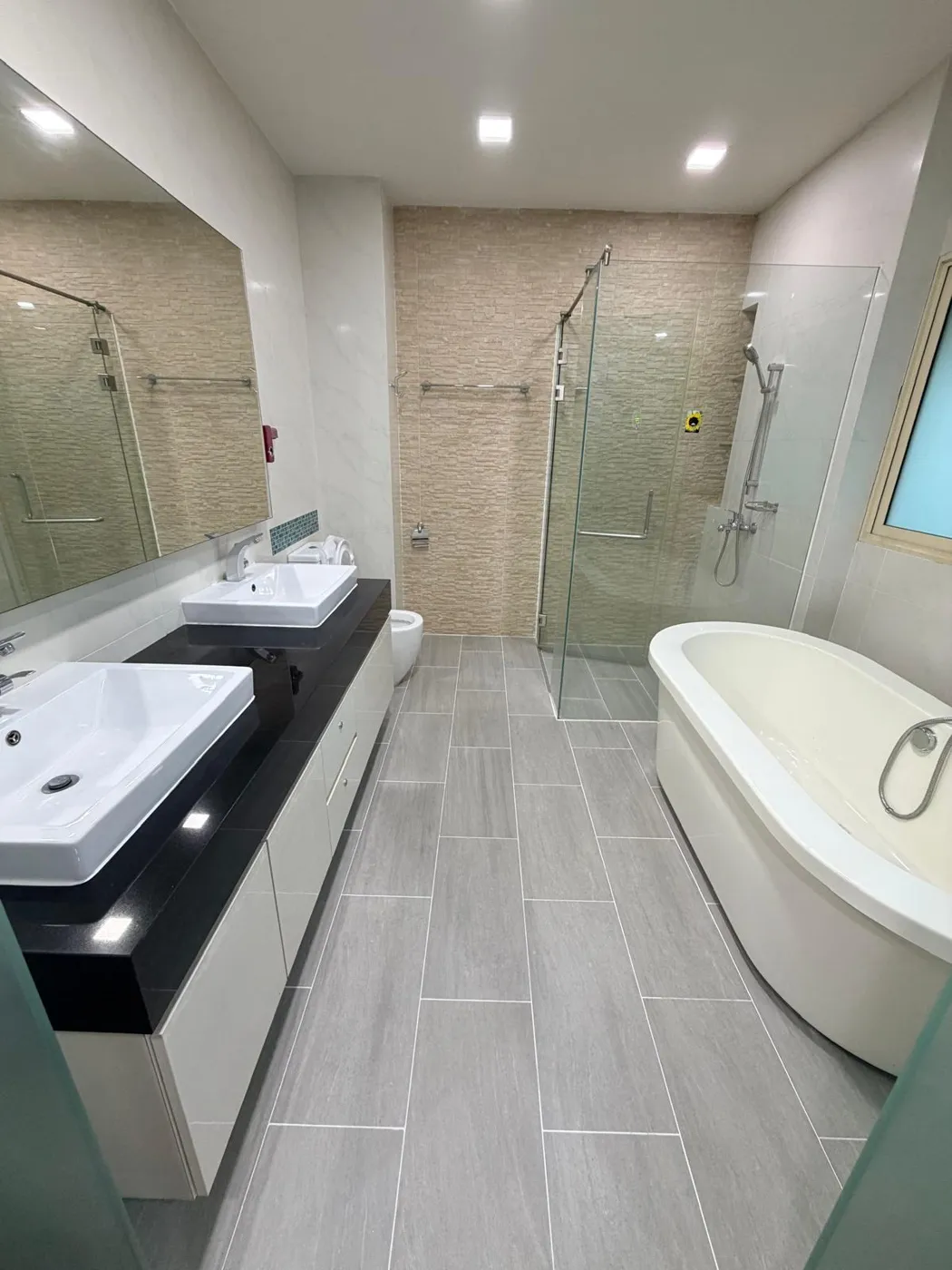 Renovated master bathroom with double basin and freestanding bathtub, Lentor Terrace