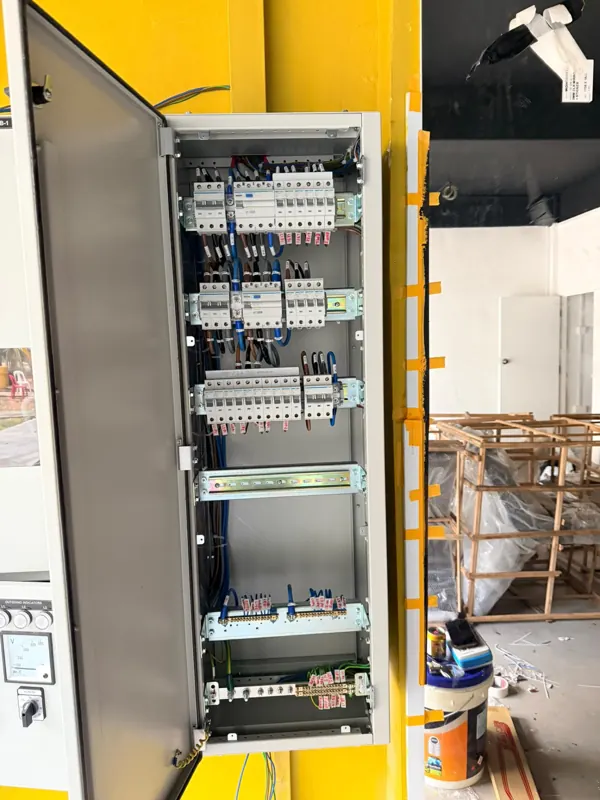 Open electrical distribution cabinet showing circuit breakers and wiring at Blk 233 Lorong 8 Toa Payoh